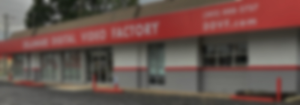 Delaware Digital Video Factory storefront located on the Concord Pike in Wilmington, Delaware.  Large red sign with white letters.